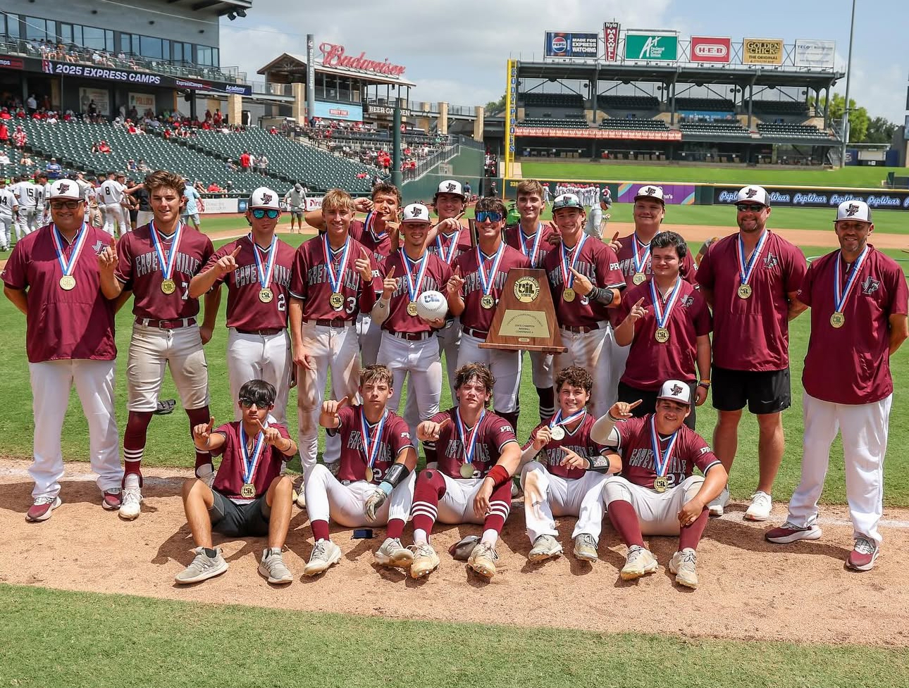Fayetteville Lions baseball team celebrating the 2025 UIL State Championship trophy