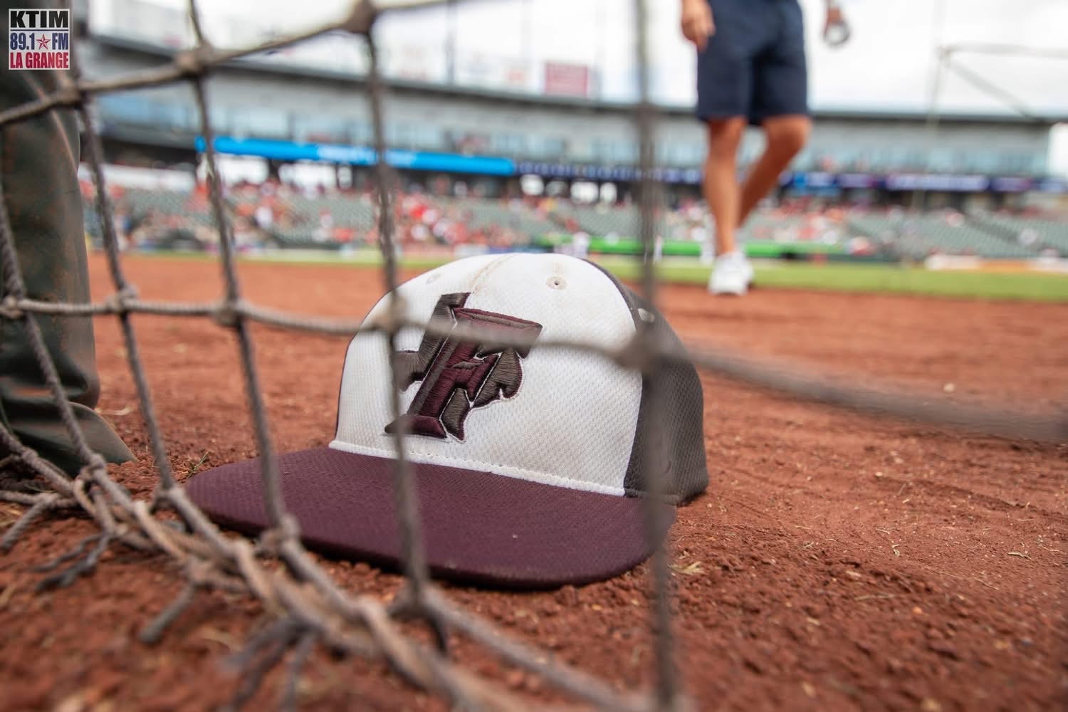 Fayetteville Lions baseball cap on the field