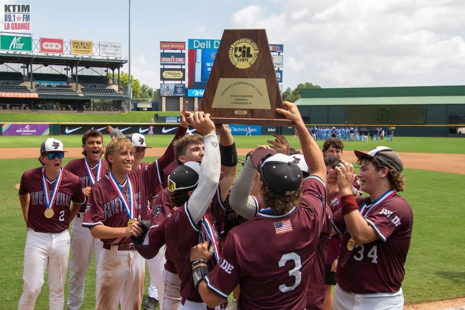 Fayetteville Lions baseball team celebrating the 2025 UIL state championship trophy