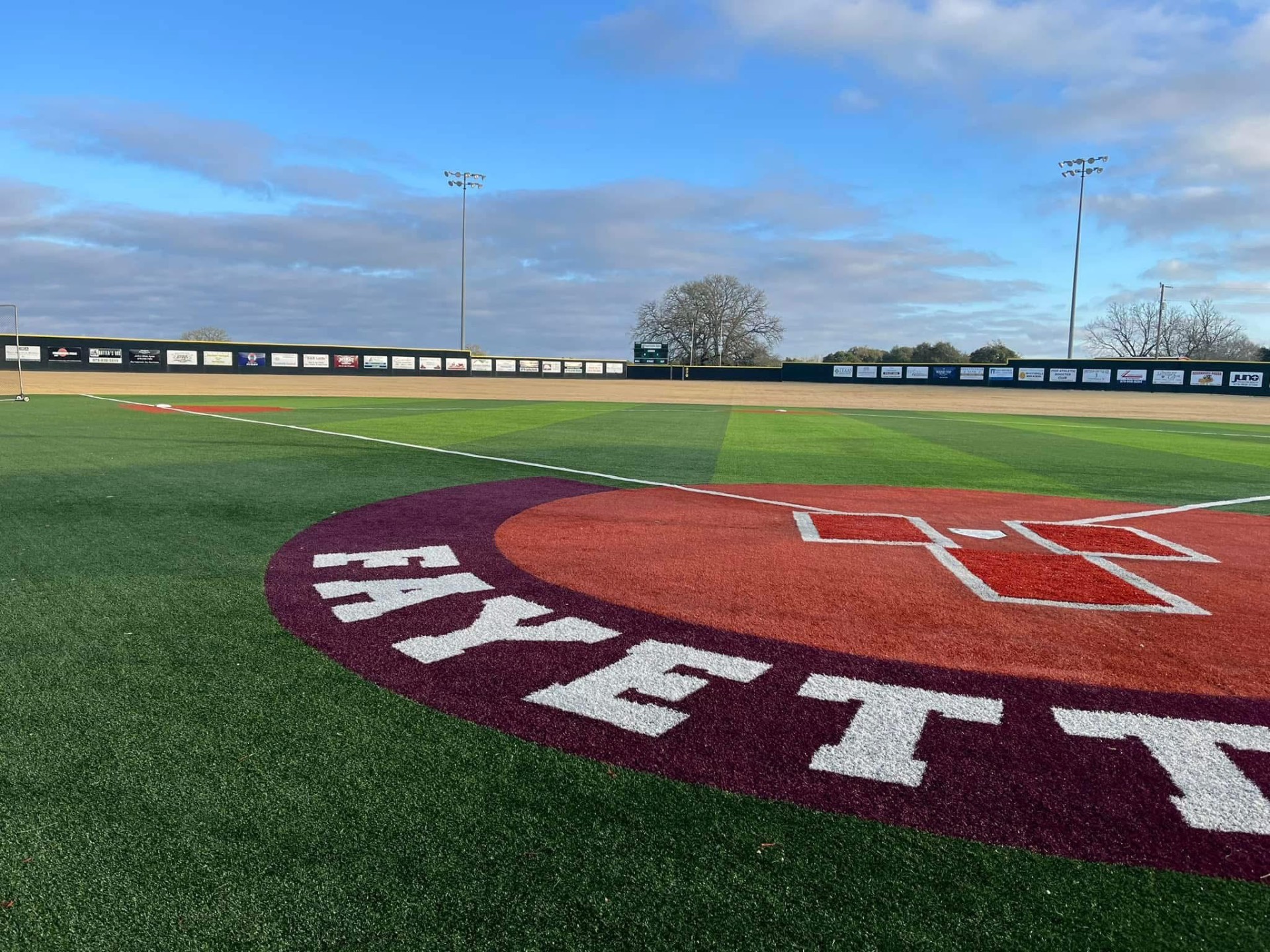 Fayetteville painted behind home plate on the turf infield